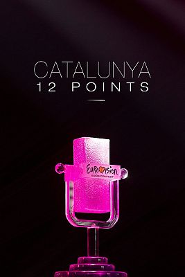A pink Eurovision trophy shaped like a microphone, on a dark background.