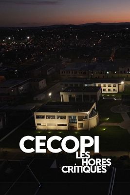Night view of a town, with the lit-up CECOPI building in Valencia in the foreground.