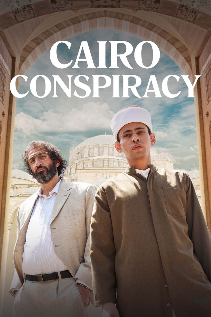 Two men, one in a white turban, in front of a mosque.
