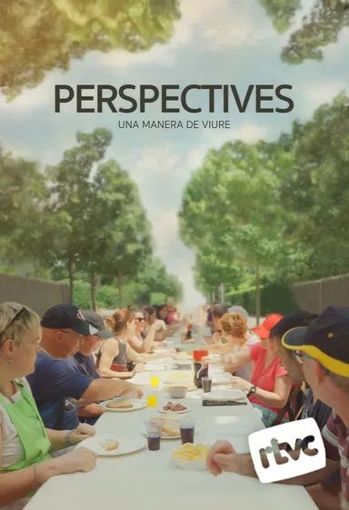 People eating together at a long outdoor table, with trees and a blue sky behind them.