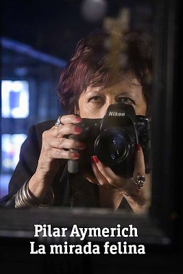 Pilar Aymerich taking a photo with her camera.
