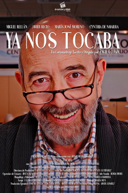 An older man with glasses and a beard smiling at the camera.